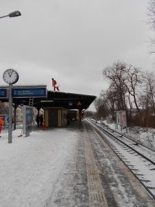 Shoveling snow off the metro in Berlin. 